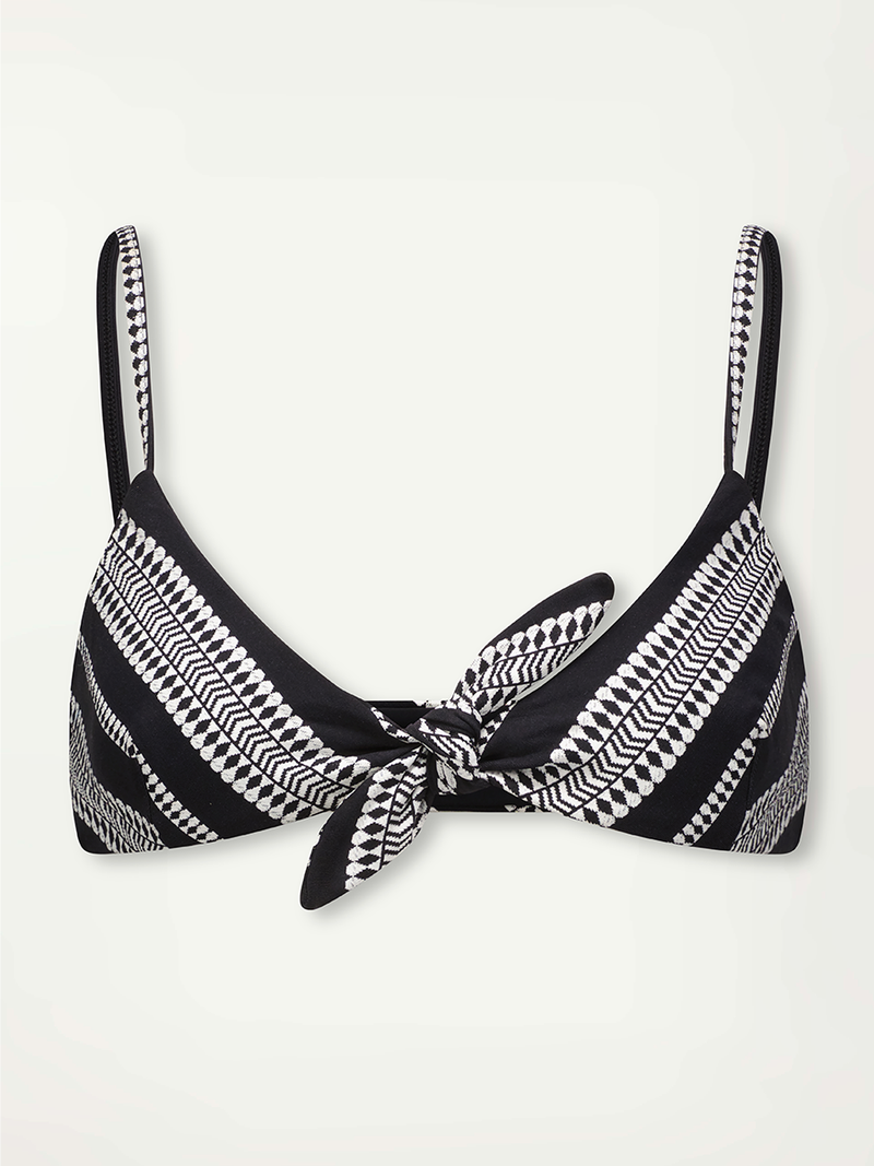 product shot of the Luchia front tie Bikini top in  black graphic white diamond and arrows.