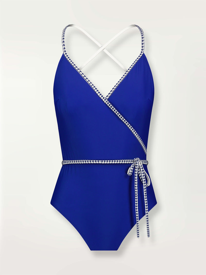 Product shot of the Lena Ballet One Piece  in bright neon blue adorned with navy and white diamond jacquard pattern on the trims