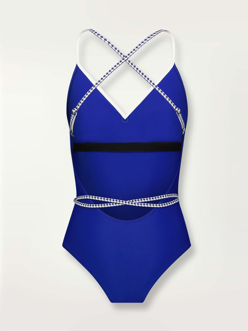 Product shot of the back the Lena Ballet One Piece  in bright neon blue adorned with navy and white diamond jacquard pattern on the trims