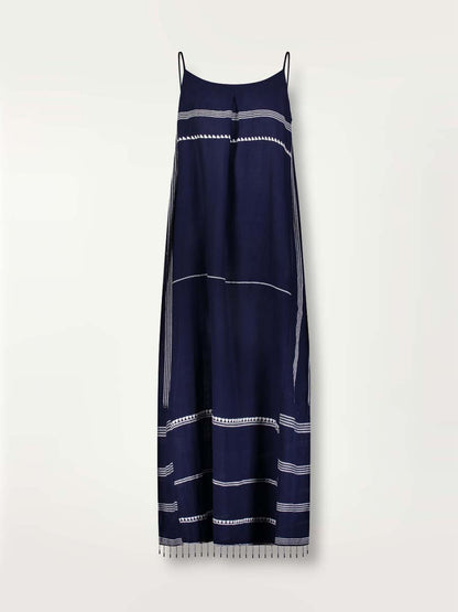 Product shot of the front of the Nunu Long Slip Dress in navy blue featuring white stripes and graphic lines.