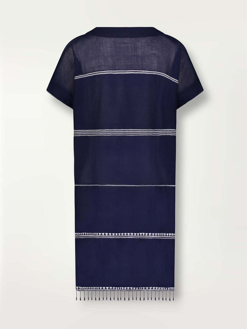 Product shot of the back of the Nunu Tunic Dress in navy blue featuring white stripes and graphic lines.