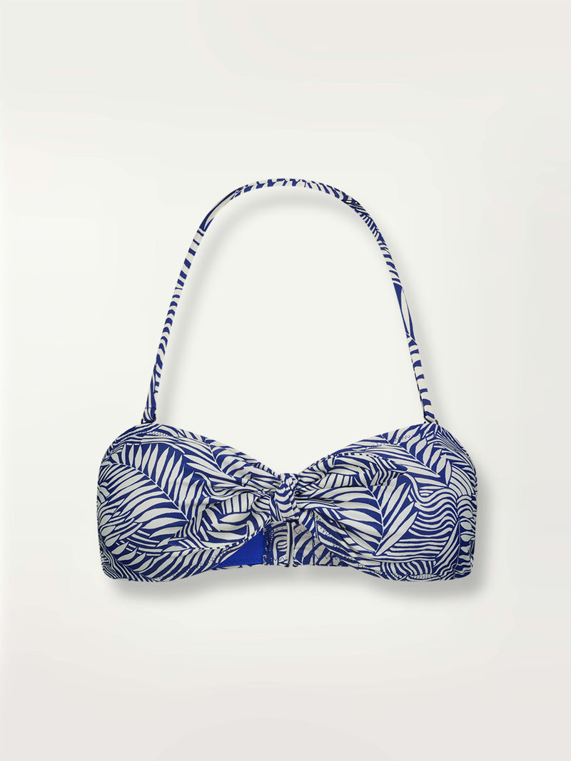 Product shot of the Palm Leaf Bandeau Top featuring palm tree patterns on a rich blue background.
