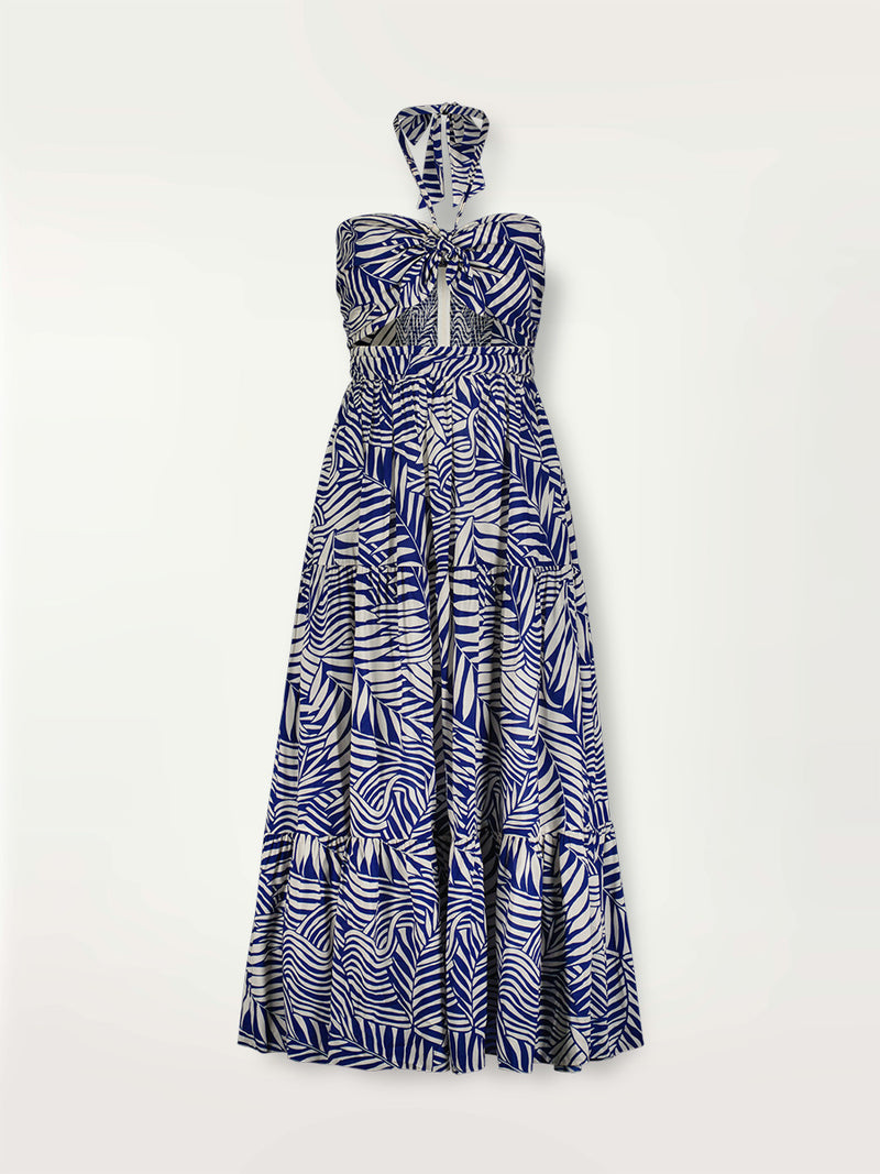 Product shot of the Palm Leaf Cutout Dress featuring palm tree patterns on a rich blue background.