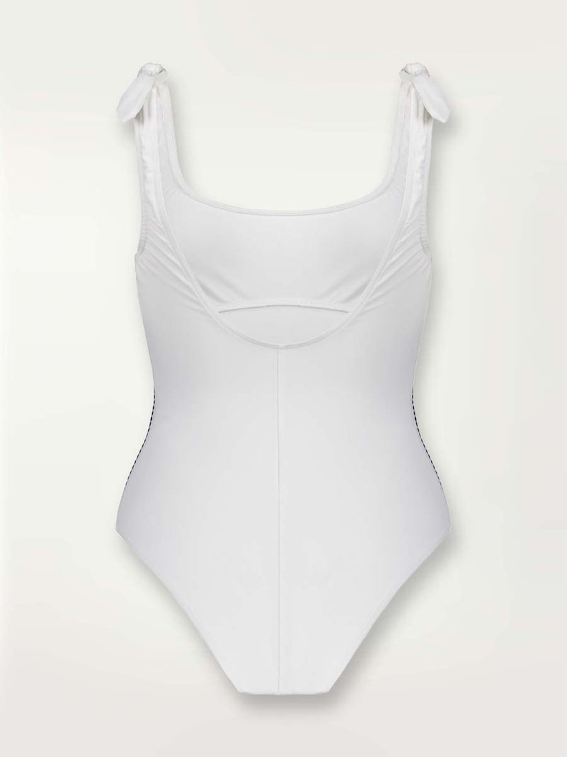 Product shot of the back of a Sofia Nageur white one piece swimsuit with graphic diamond trim