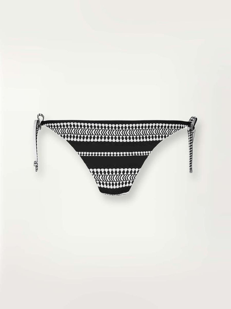 product shot of the Luchia String bikini bottom in black with graphic white diamond and arrows.