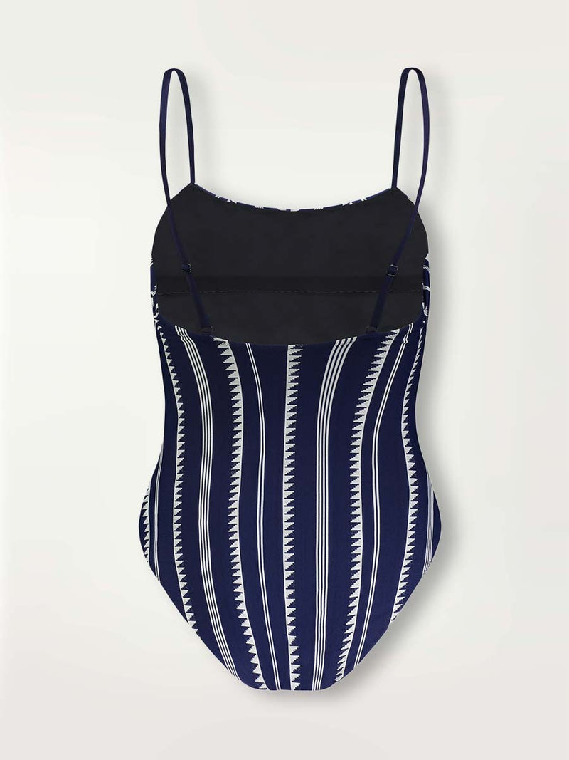 Product-shot back view of a navy Nunu classic one piece swimsuit with white triangles and stripes