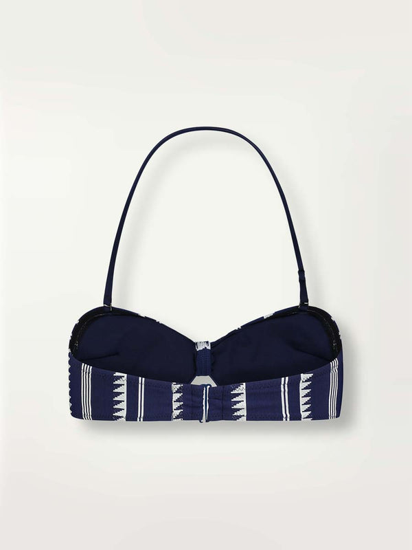 Product-shot back view of a navy Nunu bandeau swim top with white triangles and stripes