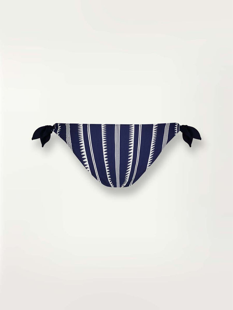 Product-shot back view of a navy Nunu side tie bikini bottom with white triangles and stripes