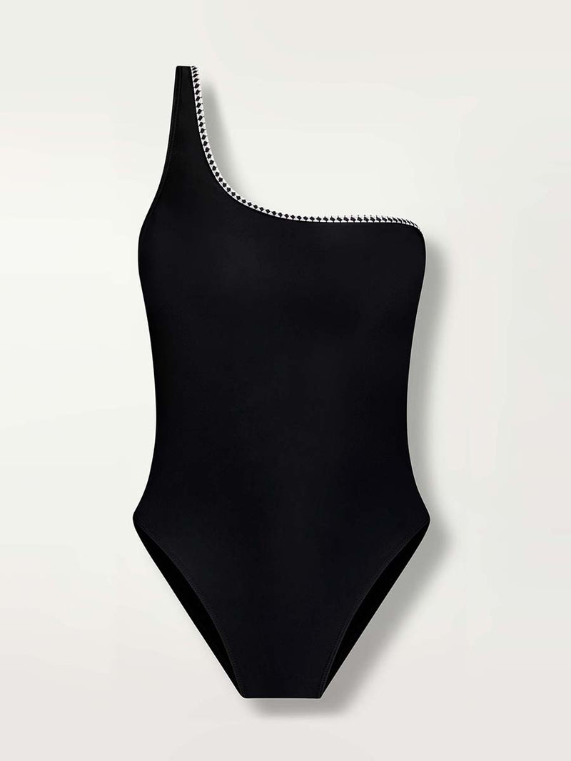 Product shot of the front of he Lena One Shoulder One Piece in Black featuring a black and white tibeb trim.