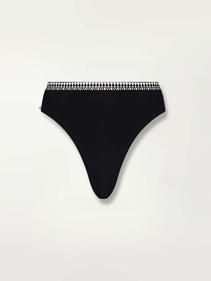 Product shot of the front of the the Lena High Leg Bottom in Black featuring a black and white tibeb waistband