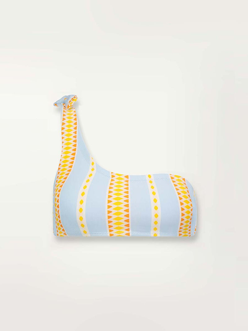 Product shot of the front of the Jemari One Shoulder Top in sky blue featuring yellow and orange diamond patterns 