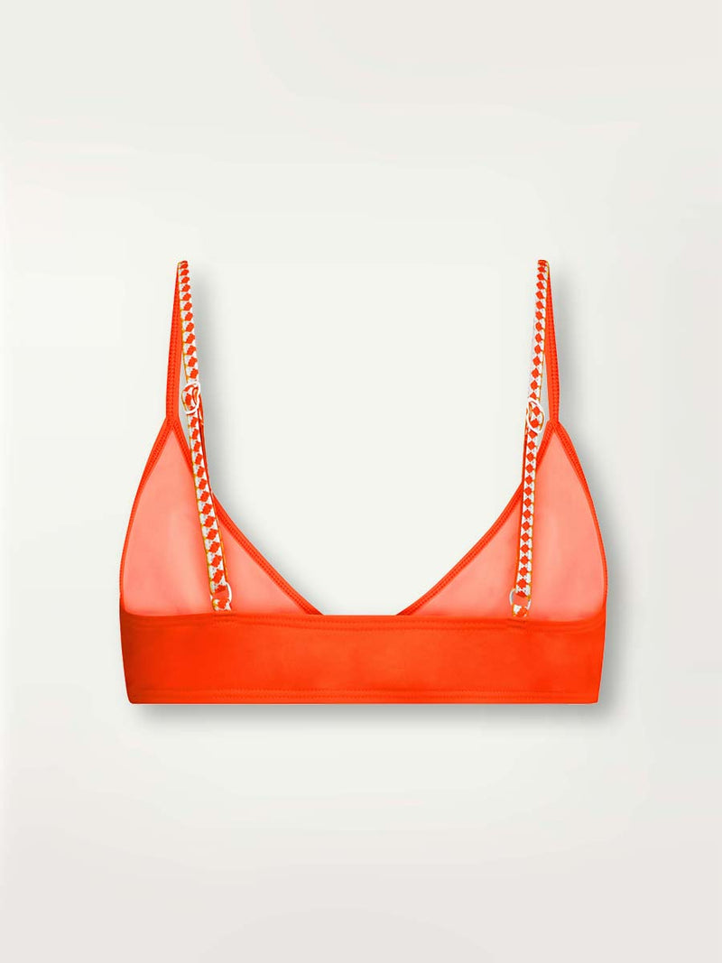 Product-shot of the back of the Lena Tie Front Top in Neon Orange featuring white and orange tibeb trim.