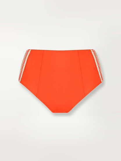 Product shot of the front ofd the Lena High Waist Bottom in Neon Orange featuring white and orange tibeb trim 