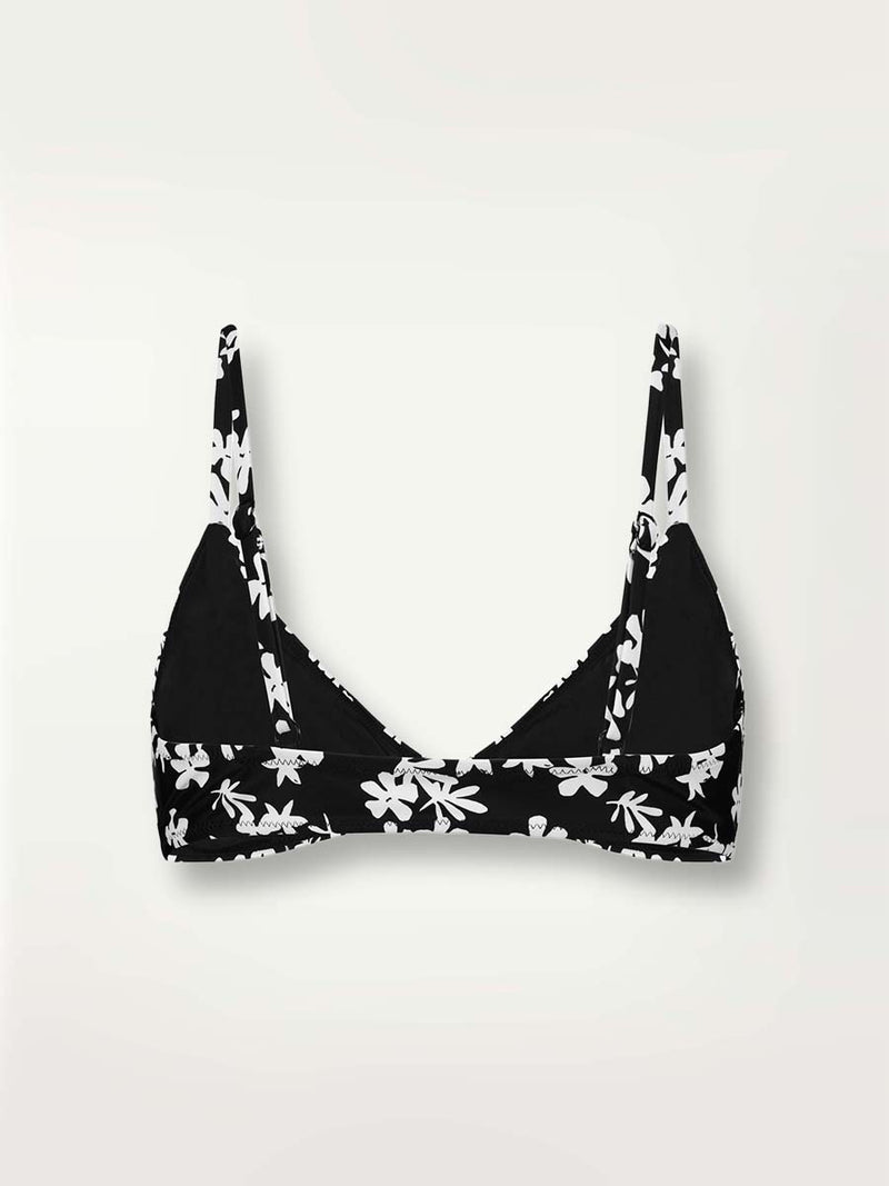 Product-shot of the back of the Sea Floral Tie Front Top in black featuring white allover floral print.