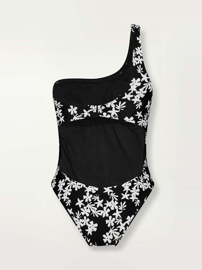 Product shot of the back of the Sea Floral One Shoulder One Piece in black featuring white allover floral print.