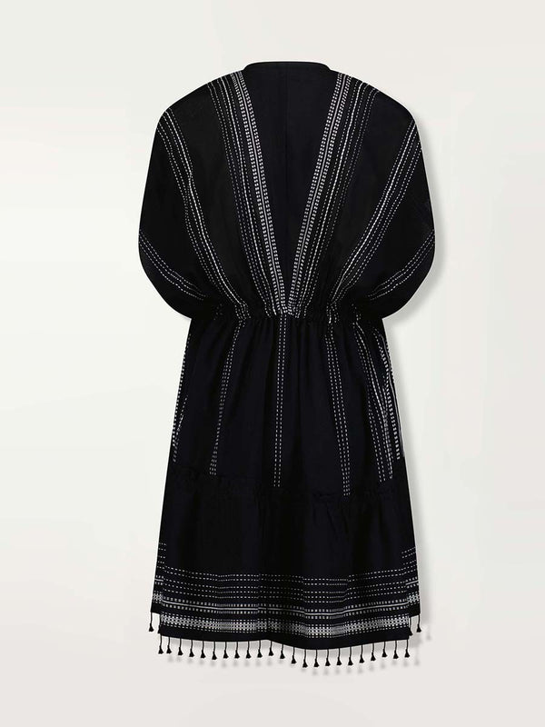 Product shot of the back of the Leliti Short Plunge Neck Dress in Black with white stitching allover.