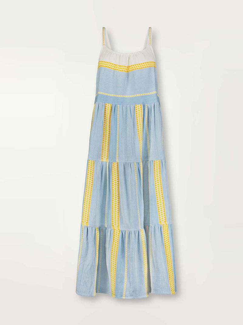 Product shot of the front of  the Jemari Cascade Dress in sky blue featuring yellow and orange diamond patterns