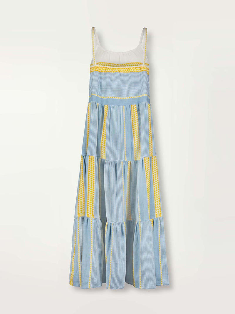 Product shot of the back of  the Jemari Cascade Dress in sky blue featuring yellow and orange diamond patterns