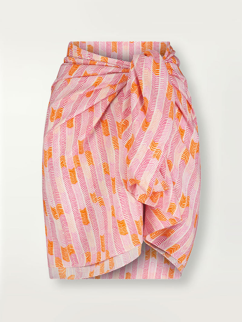 Product shot of the Gigi Sarong in Multi Pink featuring pink, peach and orange allover chevron print and strips of gold lurex.