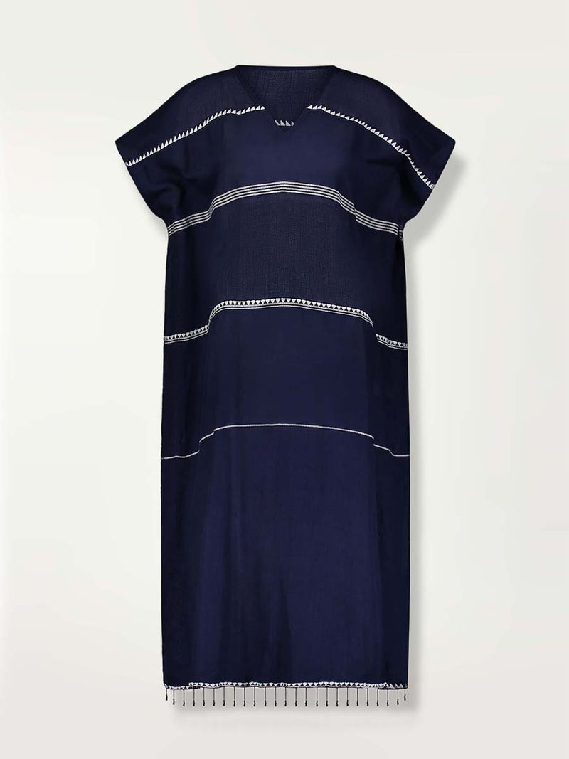 Product shot of the front of the Nunu classic caftan in navy blue featuring white stripes and graphic lines.