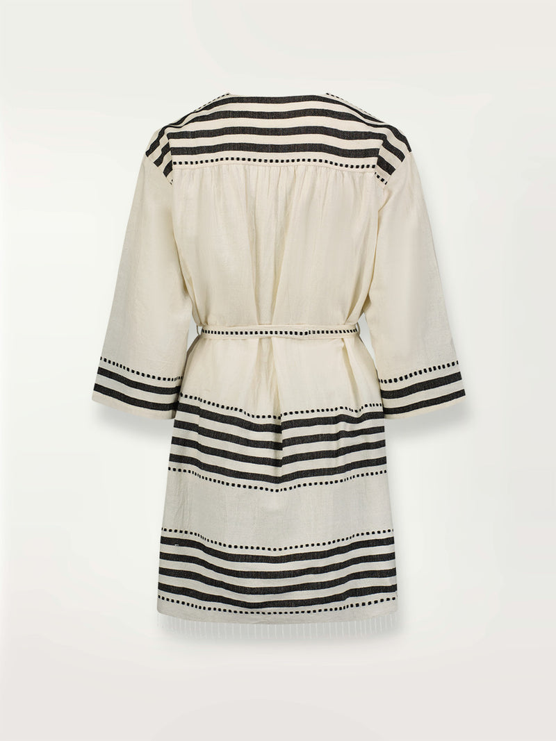 Product shot of the back the Eshe Short Robe featuring architectural and textured black stripes and dotted lines on an off white background.